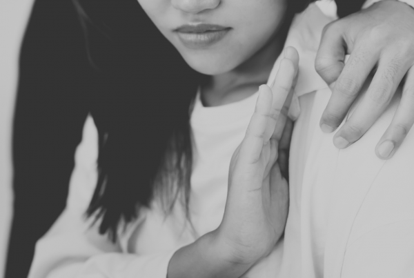 Woman rejecting unwanted advances from male colleague