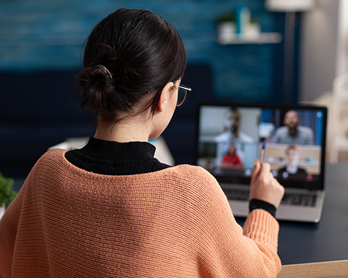 Woman watching webinar on laptop