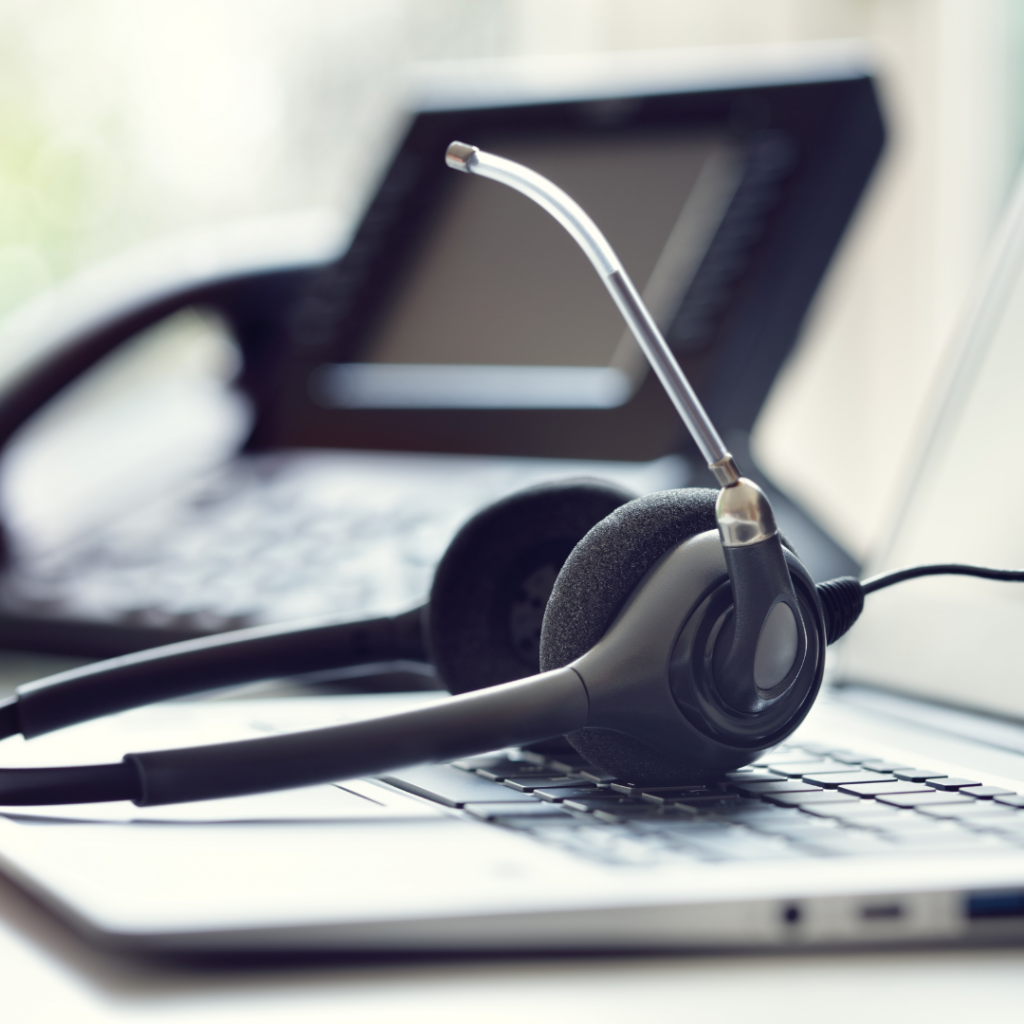Headphones laying on a laptop keyboard
