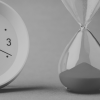 Picture of a clock next to a sand timer