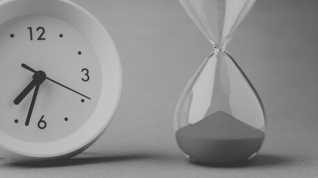 Picture of a clock next to a sand timer
