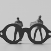 A pair of glasses looking at to different people