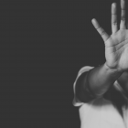 Women with hand out in front of her face