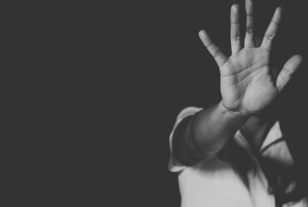 Women with hand out in front of her face