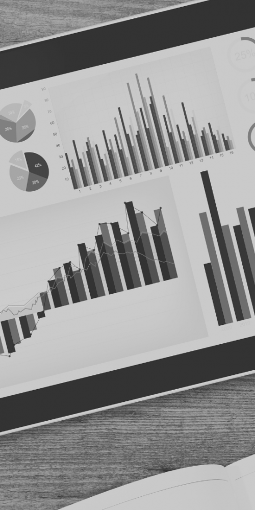 Image of tablet and phone with graphs on them