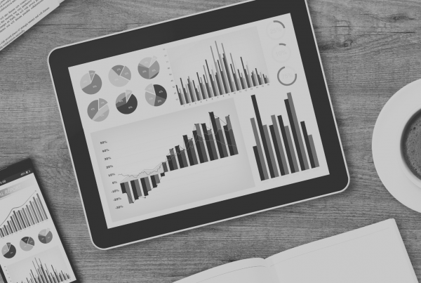 Image of tablet and phone with graphs on them