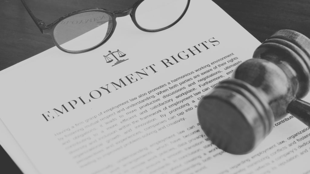 Copy of paper with employment rights written on, sat on top of a desk