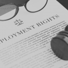 Copy of paper with employment rights written on, sat on top of a desk