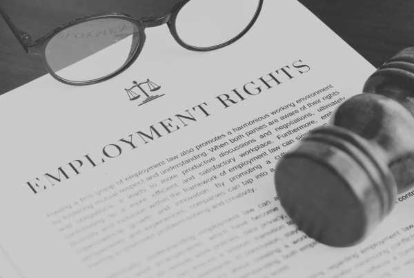 Copy of paper with employment rights written on, sat on top of a desk