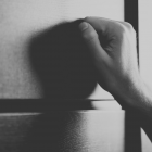 Hand knocking on door