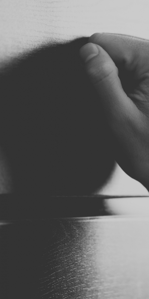 Hand knocking on door