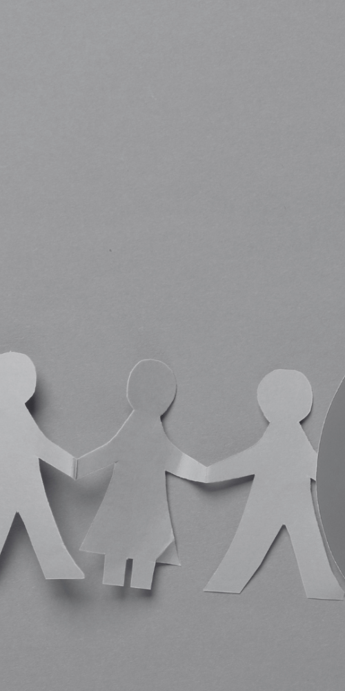 Line of paper cut people with stop sign over two of the people showing that they're excluded