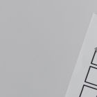 White paper with three boxes and a tick in one box