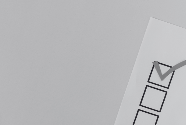 White paper with three boxes and a tick in one box